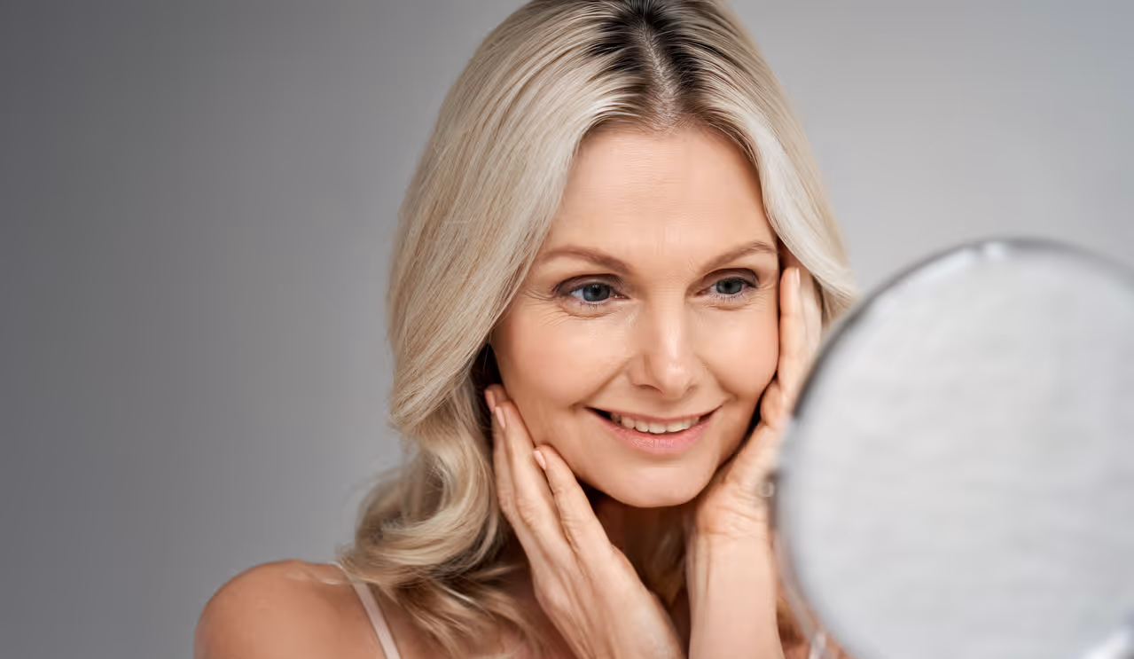 A concierge team member reviewing treatment pricing with a patient in a private consultation room